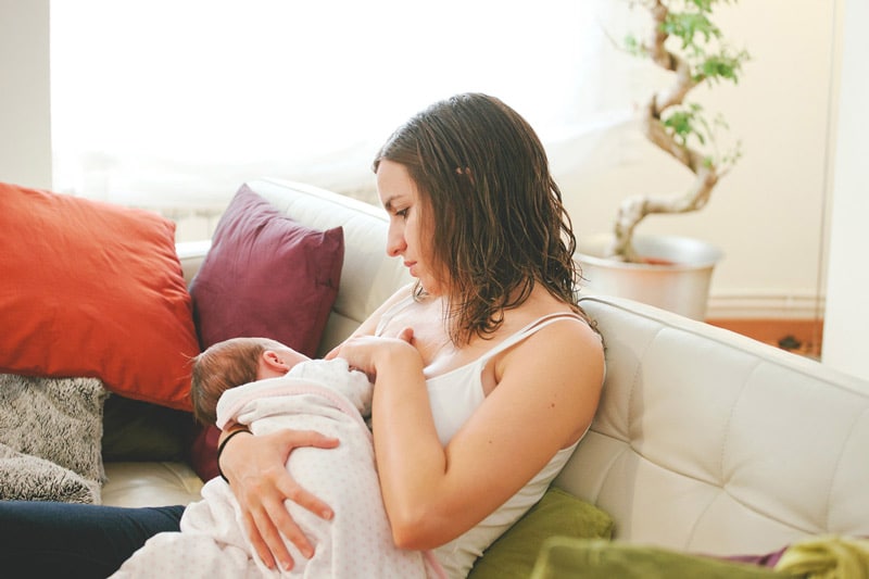 woman nursing baby