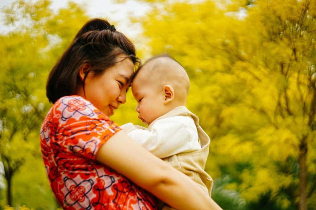 postpartum mom holding her baby